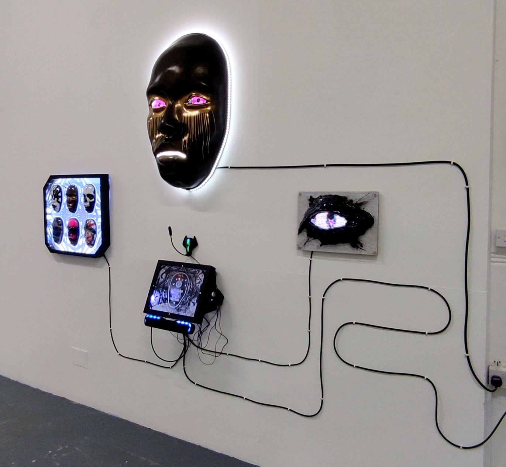 AILA full installation on white gallery wall with all peripheral components visible