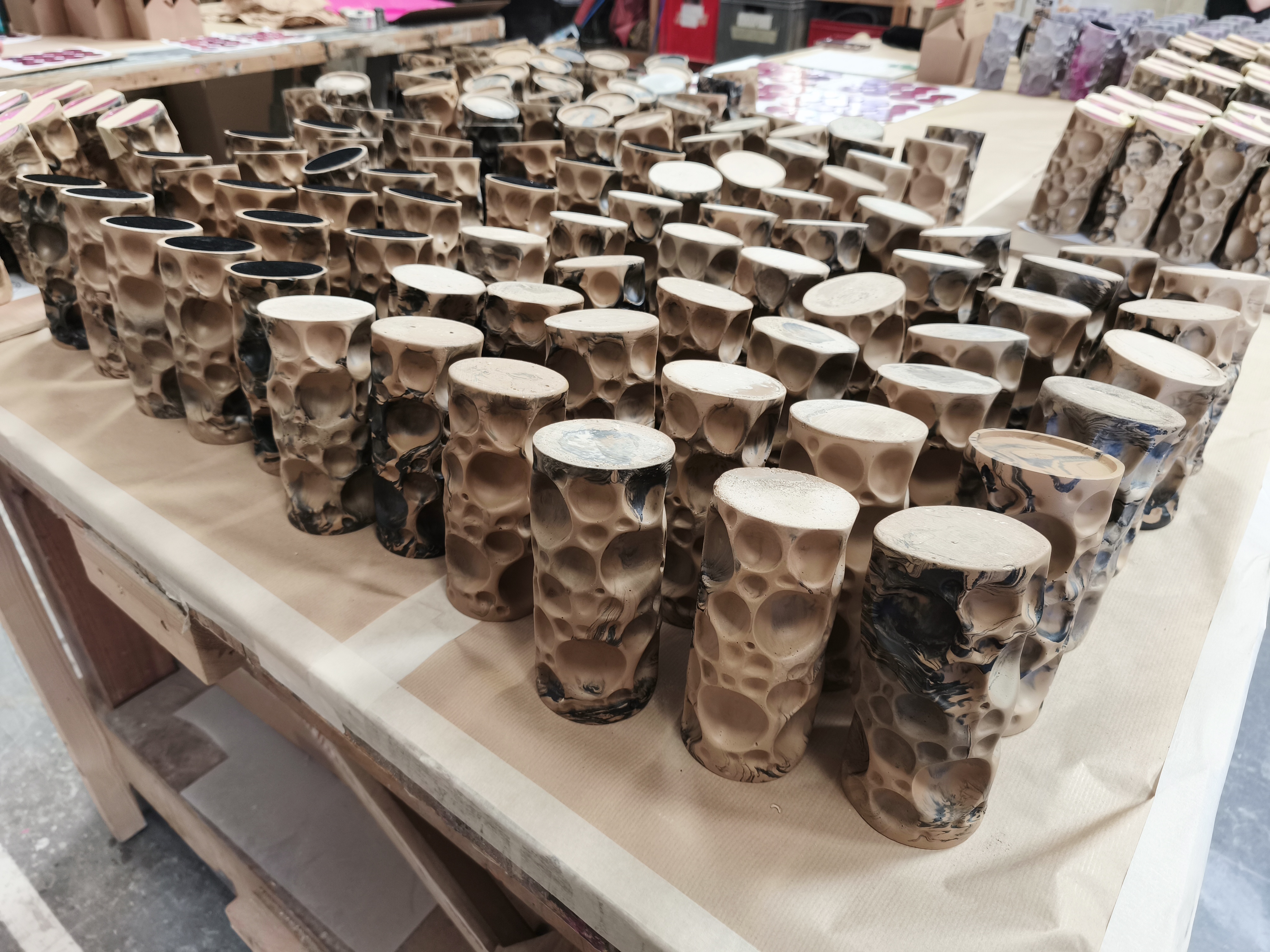 Full production run of Creative Circle Awards laid out on workbench
