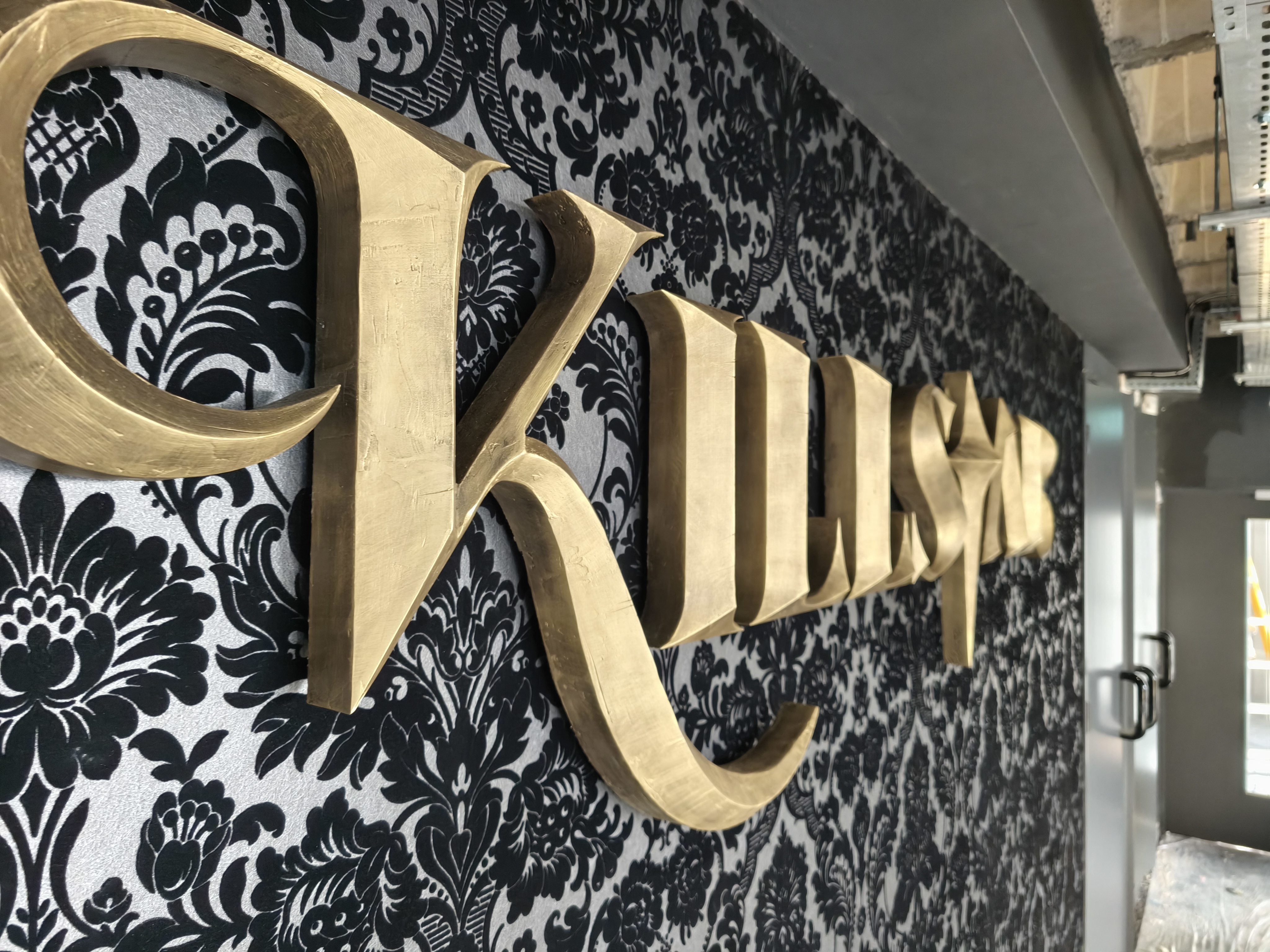 Very close angled shot of K swash and letter depth on Killstar signage